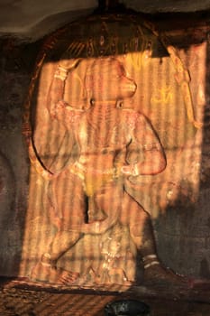 Rock-cut Anjaneya statue at temple in Badami, Karnataka, India, Asia