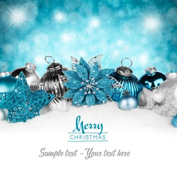 Turquoise silver Christmas decoration on snow