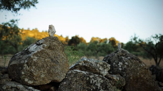 Details of a pebble in balance on rocks.