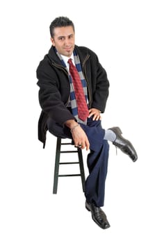 A young businessman sitting on a chair .and looking relaxed, for white background..