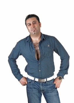 A young tall man standing for white background very relaxed with his.hands on his hips..