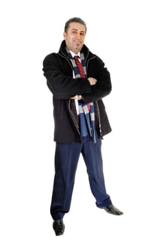A tall and young businessman standing in a black coat for.white background with his arms crossed..