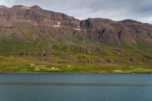 sea sky and meadows in Husavik in Iceland