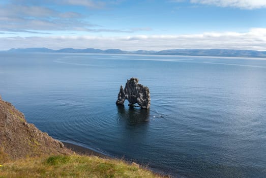 rock dragon drinking on the peninsula in Iceland Vatnsnes