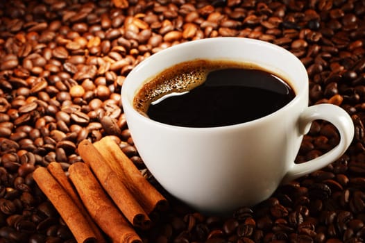 Composition with cup of coffee and beans