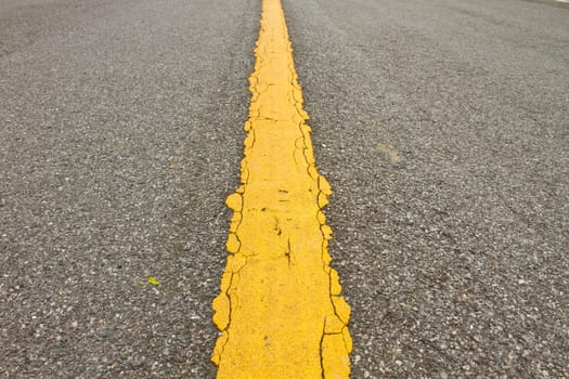 Asphalt dark texture with yellow lines