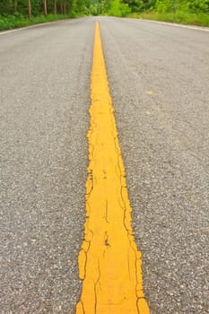 Asphalt dark texture with yellow lines
