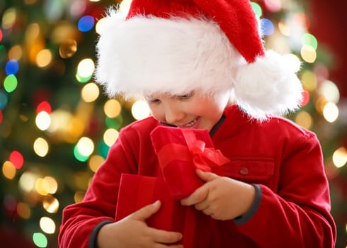 happy boy holding Christmas present