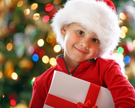 happy boy holding Christmas present