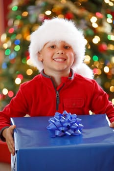 happy boy holding Christmas present