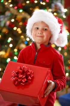 happy boy holding Christmas present