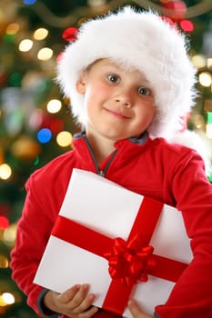 happy boy holding Christmas present