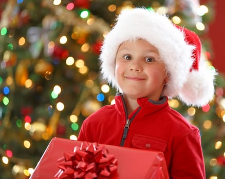 happy boy holding Christmas present
