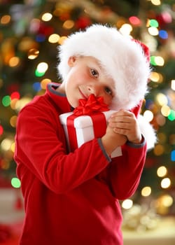 happy boy holding Christmas present