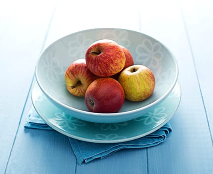 Fresh ripe apples on a plate close up