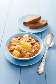 Fresh turnip stew - jota, with potatoes and beans close up