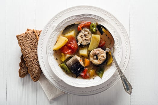 Healthy hot fish stew close up shoot