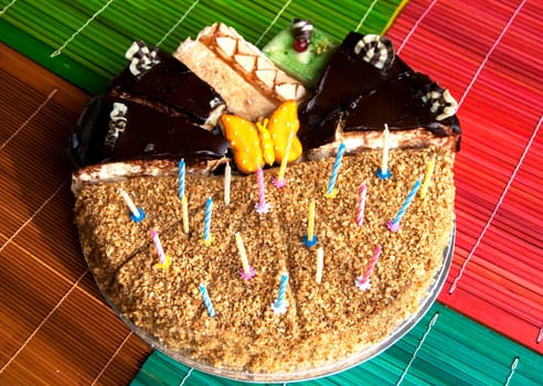 Various pieces of cake with candles for celebration