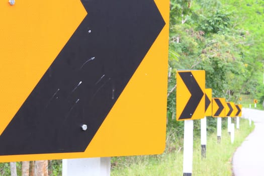 Road Signs warn Drivers for Ahead Dangerous Curve