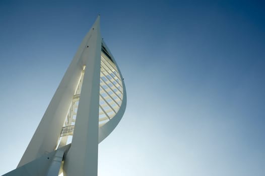 Sunshine behind the 560ft (170m) Spinnaker Tower, Britains highest tourist observation platform. Portsmouth, UK - February 1, 2012