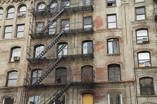 Old building with outdoor staircase (New York City, USA). Horizontally.