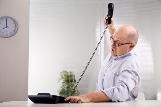nerdy furious clerk smashing the phone