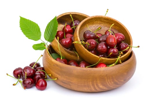 fresh cherries in a bowl on white background