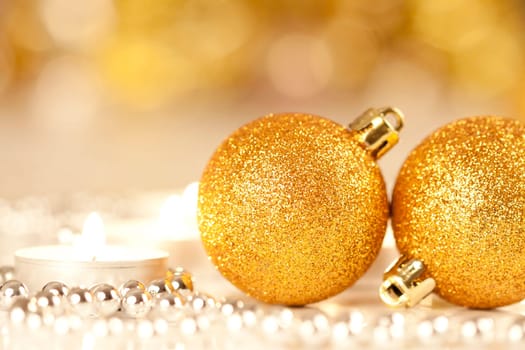 Christmas decoration candles and balls on holiday background