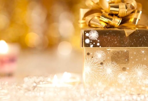 Gift box and candles and holiday lights