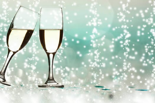 Two glass of champagne and colorful lights