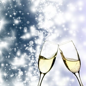 Glasses of champagne against holiday lights