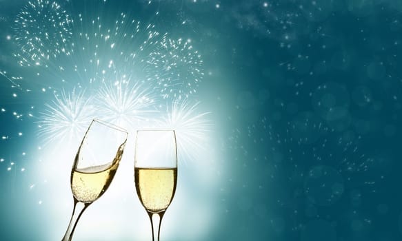 Glasses with champagne against holiday lights