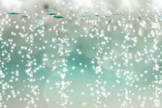 Abstract Christmas background of holiday lights, stars, and snowflakes