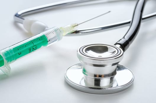 Stethoscope with syringe