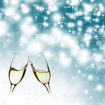 Glasses with champagne against fireworks close to midnight