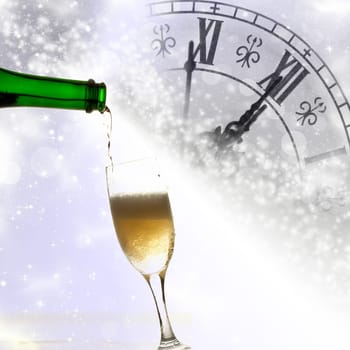 Pouring champagne against clock close to midnight and holiday lights