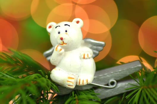 christmas decoration, white bear angel on clip against bokeh background