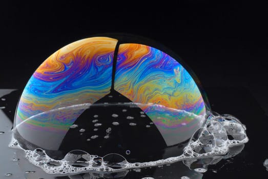 soap bubble in reflexing light with interference colors,high dynamic,soap lamella macro