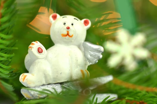 christmas decoration, white bear angel on clip against bokeh background
