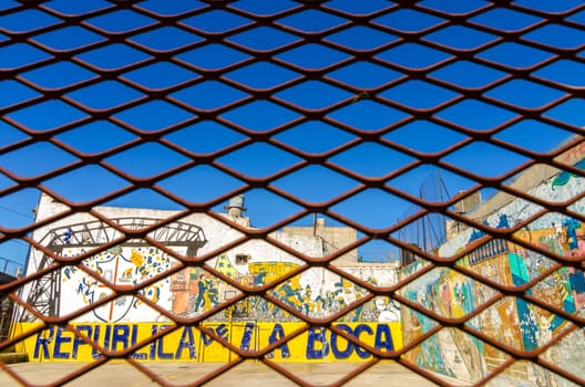 BUENOS AIRES - AUGUST 15: Grafitti in La Boca neighborhood of Buenos Aires on August 15, 2013.  La Boca is one of the main tourist destinations in the city and is also the birthplace of tango