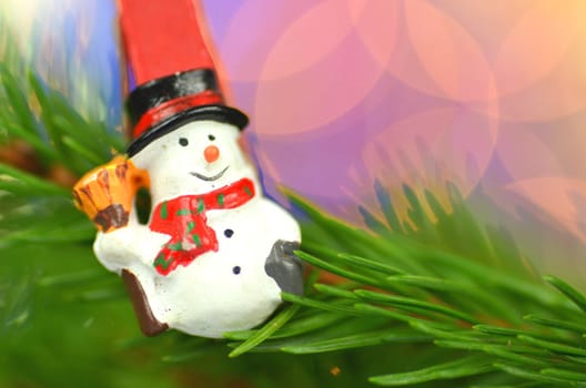 christmas decoration, snowman on clip against bokeh background