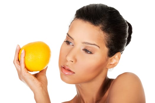 young beautiful spa woman with orange in her hand,isolated on white