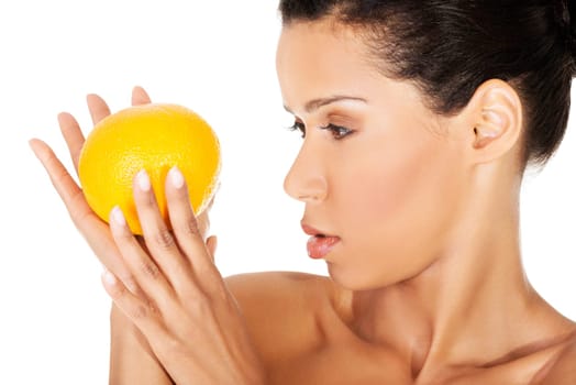 young beautiful spa woman with orange in her hand,isolated on white