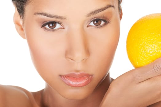 young beautiful spa woman with orange in her hand,isolated on white