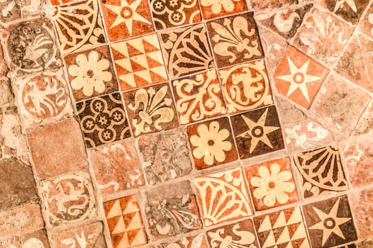 background of ancient medieval floor tiles dating from the 13th century