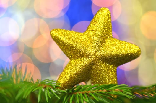 christmas decoration, golden brocade star against bokeh background