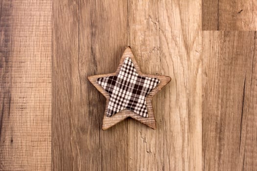 Decoration on wooden background with patterned star