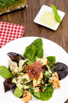 Plate of lettuce,ham,cress and fried poultry