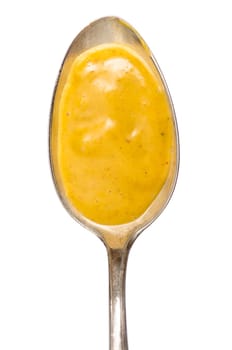 Spoon with spicy curry sauce in portrait format