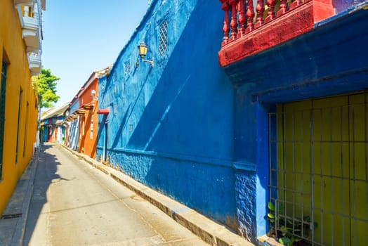 Alley leading past historic colonial houses in the Getsemani neighborhood of Cartagena, Colombia